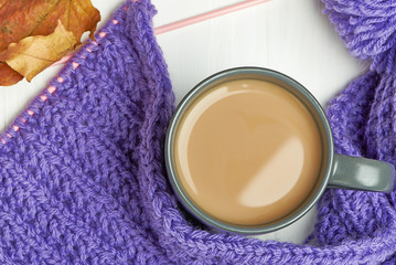 Warm cap, scarf and hot drink