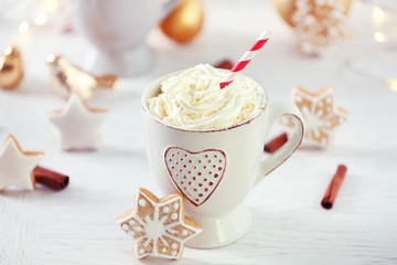 Beautiful composition with cup of cappuccino and Christmas cookies