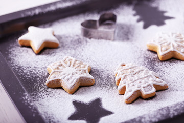 Fototapeta na wymiar Beautiful Christmas cookies on oven-tray, close up