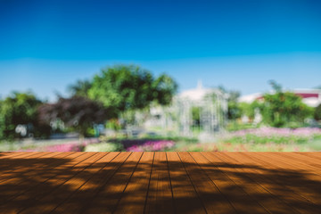 Obraz premium Beautiful sunlight in the autumn forest with wood planks floor