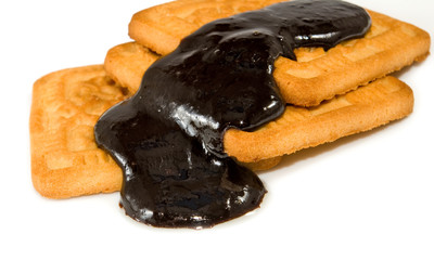 Isolated image of cookies poured chocolate