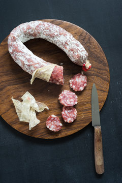 Overhead view of french salami on cutting board