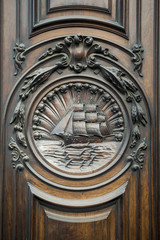 Architectural detail of an old wood door on the exterior of a traditional building in on the historical Avenida Rio Branco in Centro, Rio de Janeiro, Brazil