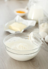 Obraz na płótnie Canvas Cooking buttery cream on kitchen