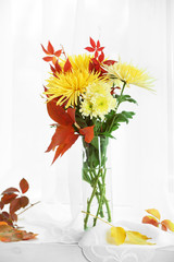 Beautiful autumn bouquet with chrysanthemums flowers, on windowsill