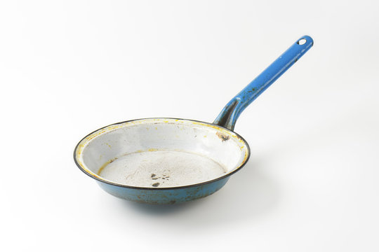 Old rusty frying pan