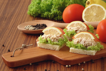 Tuna sandwich on chopping board