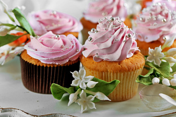 Tasty cupcakes on plate, close-up