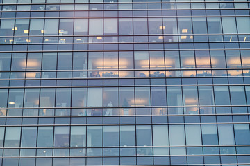 Fototapeta na wymiar Office building glass facade with interior lamps light. Moscow, Russia. 