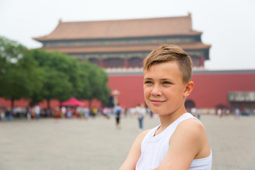 Fototapeta na wymiar Boy in the Imperial Forbidden City in Beijing, China.