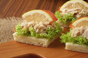 Tuna sandwich on chopping board
