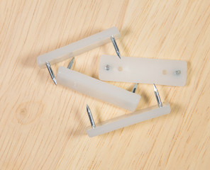 Elements of fastening pieces of furniture.