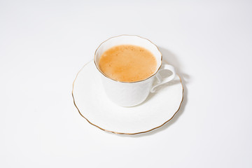 White cup of espresso coffee on white background