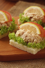 Tuna sandwich on chopping board