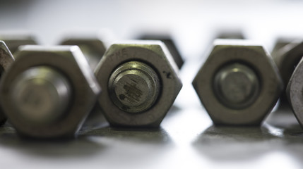 Close-up of various steel nuts and bolts