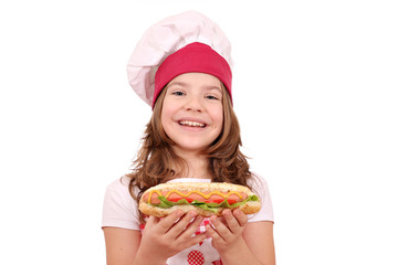 happy little girl cook with hot dog