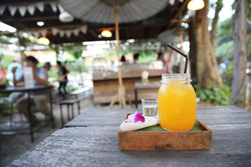 Orange juice on wood background