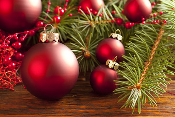 Obraz na płótnie Canvas Christmas background - baubles and branch of spruce tree