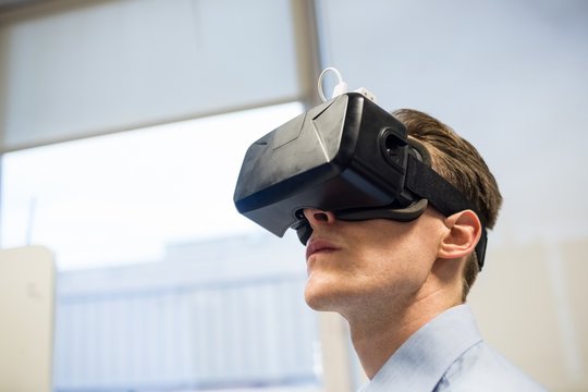 Businessman using oculus rift headset