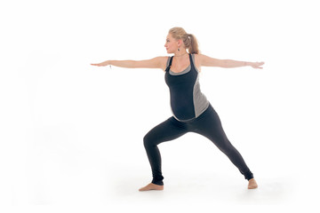 Obraz premium Pregnant woman doing sport exercises in yoga style