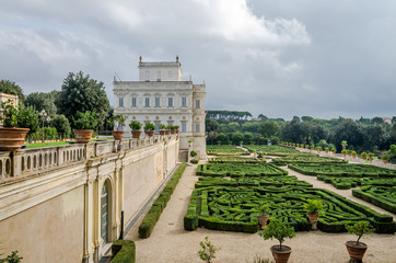 Historically, an important architectural building landmark castle with garden and flowers and shrubs ladshaftnym design in the form of labyrinth in park at Villa Pamphili in Rome, capital of Italy