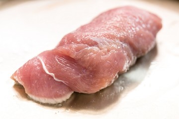 cooking meat in a frying pan