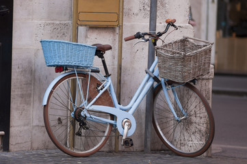 Fototapeta premium vintage bike with basket parked on the street