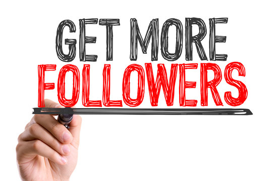 Hand with marker writing: Get More Followers
