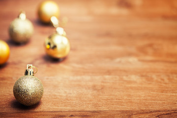 Close up of beautiful christmas decoration, golden baubles on ol