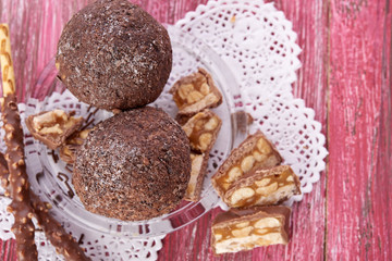 Cupcake with chocolate on wooden background