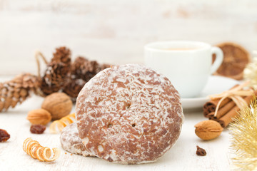 cookies with cup of coffee on white wooden background