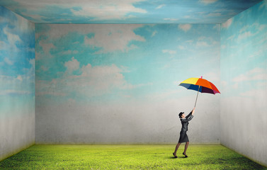 Woman flying on umbrella