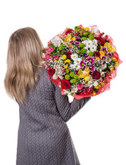 girl with brown hair with a beautiful bouquet in hand back to th