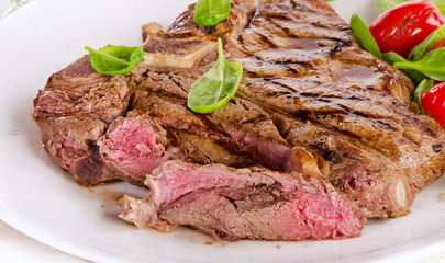 Fototapeta premium Beef steak served with green salad.