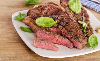 Beef steak served with  fresh salad.