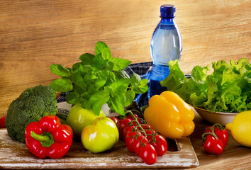 Fresh organic vegetables with bottle of water