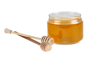 honey and sticks isolated on white background
