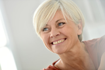 Portrait of smiling blond senior woman