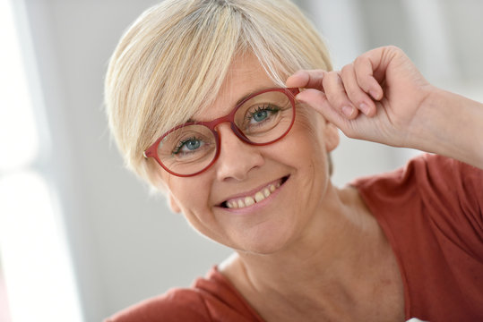 Portrait of smiling senior woman with eyeglasses