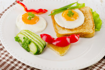 Fototapeta na wymiar Fried eggs with fresh vegetables