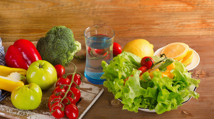 Fresh vegetables and fruits with glass of water