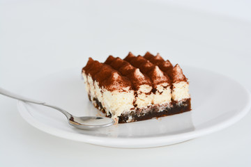 Tiramisu coffee cake served on a white plate