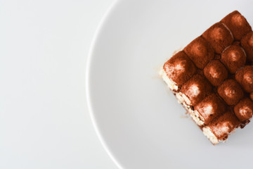 Tiramisu coffee cake served on a white plate
