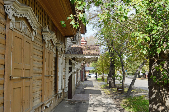 The wooden house with closed window shutters on Irkutsk street