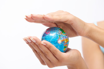 woman's hand with globe