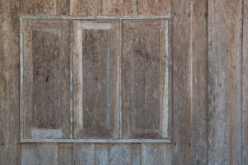 Old wooden windows on the old wood wall.