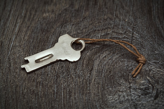 vintage key on wooden surface