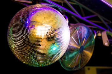 disco ball in the club reflects the bright illumination