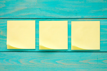 Three blank  sticky notes