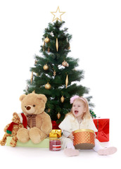 little girl at the Christmas tree